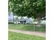 Quaint home featuring a fenced yard and mature trees offering shade and privacy at 3101 Danbury Rd, Indianapolis, IN 46222