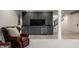 Finished basement with gray cabinets, wine fridge, black countertop and recessed lighting at 3549 W 131St St, Carmel, IN 46032