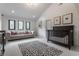 Bright room features a white couch, crib, vaulted ceiling, and three windows at 3549 W 131St St, Carmel, IN 46032