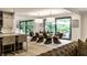 Bright dining room with modern chandelier, modern furniture, and sliding doors to the patio at 3549 W 131St St, Carmel, IN 46032