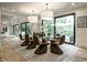 Beautiful dining room featuring a glass table, stylish chairs, and large windows overlooking the backyard at 3549 W 131St St, Carmel, IN 46032