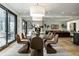 Open-concept dining room featuring modern chairs and a glass table with views of the living room at 3549 W 131St St, Carmel, IN 46032