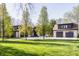 A beautiful two-story home is showcased with its well-maintained lawn and long driveway at 3549 W 131St St, Carmel, IN 46032