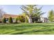Charming home with a lush green lawn and manicured landscaping, creating a serene and inviting curb appeal at 3549 W 131St St, Carmel, IN 46032