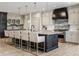 Modern kitchen featuring a dark island with seating and gray cabinets with marble countertops at 3549 W 131St St, Carmel, IN 46032