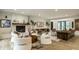 Spacious living room featuring a stone fireplace, modern furniture, and an open layout at 3549 W 131St St, Carmel, IN 46032