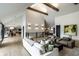 Spacious living room with vaulted ceilings, wood beams, contemporary furniture and open floor plan at 3549 W 131St St, Carmel, IN 46032