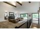 Bright living room featuring vaulted ceilings, wood beams, stylish decor and open floor plan at 3549 W 131St St, Carmel, IN 46032