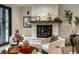 Elegant living room with fireplace, stylish decor, and hardwood floors offering a refined and cozy ambiance at 3549 W 131St St, Carmel, IN 46032