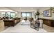 Expansive living room featuring modern decor, an open layout, and a stone fireplace at 3549 W 131St St, Carmel, IN 46032