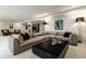 Finished basement with sectional couch, stone coffee table, and recessed lighting at 3549 W 131St St, Carmel, IN 46032