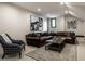 Classic living room with leather sectional, area rug, accent chair and recessed lighting at 3549 W 131St St, Carmel, IN 46032