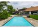 Inviting pool with modern design, surrounded by a patio and complemented by manicured landscaping at 3549 W 131St St, Carmel, IN 46032