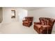 Cozy sitting area with leather chairs and warm lighting, great for relaxing and reading at 3549 W 131St St, Carmel, IN 46032