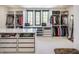 Large walk-in closet with custom shelving, storage, and a large window providing natural light at 3549 W 131St St, Carmel, IN 46032