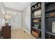 Inviting entryway features a tiled floor, decorative door, and built-in shelving for storage and decor at 3571 S Cedar Creek Ln, New Palestine, IN 46163