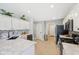 Bright kitchen featuring white cabinets, granite countertops, and stainless steel appliances at 3571 S Cedar Creek Ln, New Palestine, IN 46163
