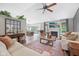 Open-concept living room featuring a fireplace, stylish furnishings, and hardwood floors at 3571 S Cedar Creek Ln, New Palestine, IN 46163