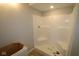 A bathroom showcasing a shower with a built-in seat and ready for finishing touches at 4141 Barrel Ln, Westfield, IN 46062