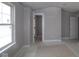 Spacious bedroom with a door leading to another room and a large window for ample natural light at 4141 Barrel Ln, Westfield, IN 46062