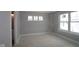 Well-lit bedroom featuring multiple windows for natural light, enhancing its airy ambiance at 4141 Barrel Ln, Westfield, IN 46062