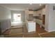Open-concept kitchen and dining area featuring white cabinets and modern design elements at 4141 Barrel Ln, Westfield, IN 46062
