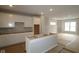Bright kitchen with white cabinetry, island, recessed lighting, and open layout for modern living at 4141 Barrel Ln, Westfield, IN 46062