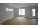 Spacious living room featuring large windows providing ample natural light and newly installed flooring at 4141 Barrel Ln, Westfield, IN 46062