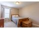 Bedroom with neutral walls, carpet flooring, and a full-size bed at 4353 W Parkway Ct, New Palestine, IN 46163