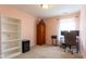 Cozy bedroom that can also serve as a home office with shelving, storage and plenty of natural light at 4353 W Parkway Ct, New Palestine, IN 46163