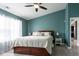 Spacious main bedroom with a queen-sized bed, bedside tables, and a ceiling fan at 4353 W Parkway Ct, New Palestine, IN 46163