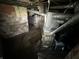 Basement featuring a newer furnace and exposed pipes; needs renovation at 4709 E New York St, Indianapolis, IN 46201