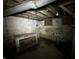Basement featuring brick and concrete walls with a workbench at 4709 E New York St, Indianapolis, IN 46201