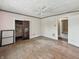 Empty bedroom with hardwood floors, ceiling fan, and neutral walls at 4709 E New York St, Indianapolis, IN 46201