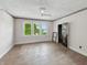 Empty bedroom with bright windows providing great natural light and hardwood floors at 4709 E New York St, Indianapolis, IN 46201