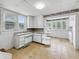 Kitchen with white cabinets, lots of natural light and an eat-in area at 4709 E New York St, Indianapolis, IN 46201