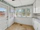 Bright kitchen featuring a white cabinets, natural light and a door to the outside at 4709 E New York St, Indianapolis, IN 46201
