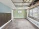 Spacious living room featuring a window and original wood floors at 4709 E New York St, Indianapolis, IN 46201