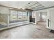 Inviting living room featuring large windows and original hardwood floors at 4709 E New York St, Indianapolis, IN 46201