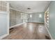 Bright living room featuring original wood floors and natural light, ready for renovation at 4709 E New York St, Indianapolis, IN 46201