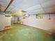 Spacious basement area with a large open space and a hanging light at 4715 E New York St, Indianapolis, IN 46201