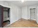 Bedroom featuring hardwood floors, an open closet, and neutral walls at 4715 E New York St, Indianapolis, IN 46201