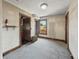 Cozy bedroom featuring a carpeted floor, trim, and window at 4715 E New York St, Indianapolis, IN 46201