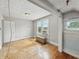 Bedroom with hardwood floors, natural light from the windows, and neutral walls at 4715 E New York St, Indianapolis, IN 46201