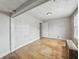 Bedroom featuring hardwood floors, an overhead light, and neutral walls at 4715 E New York St, Indianapolis, IN 46201