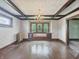 Charming dining room with beautiful windows, custom built-ins, hardwood floors, and a decorative chandelier at 4715 E New York St, Indianapolis, IN 46201
