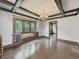 Spacious dining room features hardwood floors, traditional radiator, and windows with custom-wrought iron detailing at 4715 E New York St, Indianapolis, IN 46201