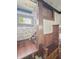 Cozy entryway featuring a window seat, wood accents and a brick wall at 4715 E New York St, Indianapolis, IN 46201