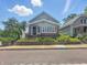 Charming two-story home featuring brick accents, a well-manicured lawn, and inviting curb appeal at 4715 E New York St, Indianapolis, IN 46201