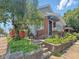An exterior shot showing the front steps, brick facade and landscaped entrance of a charming home at 4715 E New York St, Indianapolis, IN 46201
